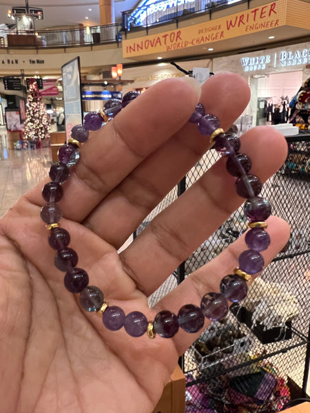 Fluorite and amethyst with sun pendant