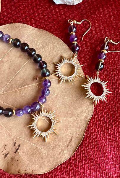 Fluorite and amethyst with sun pendant