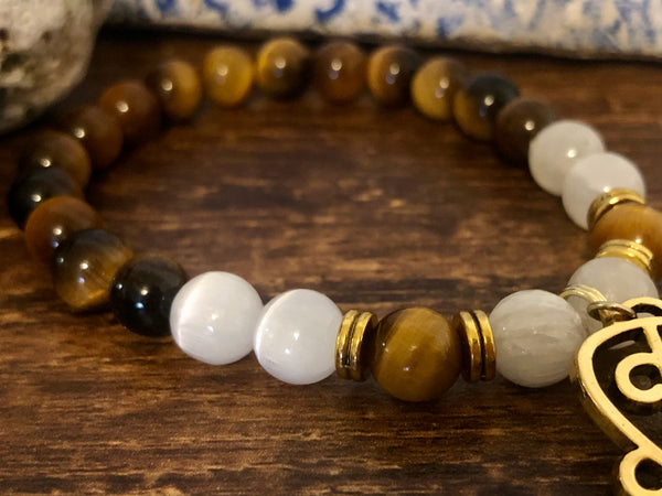 “Love never loses its way home” Tiger eye & Selenite
