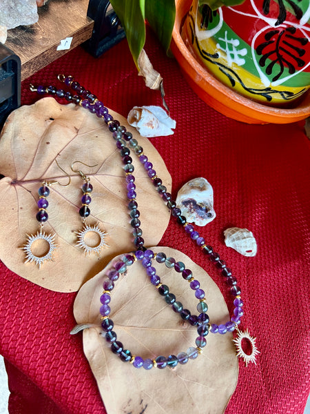 Fluorite and amethyst with sun pendant
