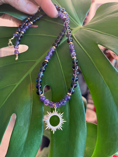 Fluorite and amethyst with sun pendant