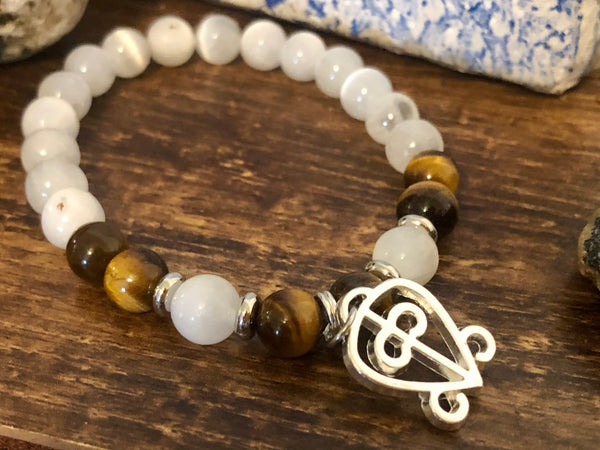 “Love never loses its way home” Tiger eye & Selenite