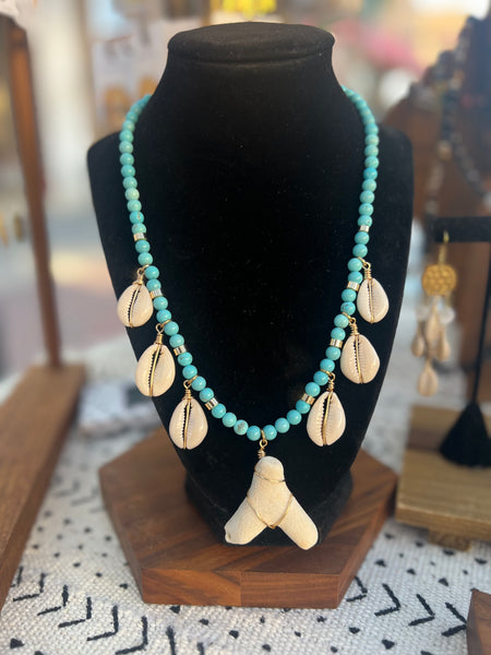 Turquoise howlite cowrie she’ll and coral necklace