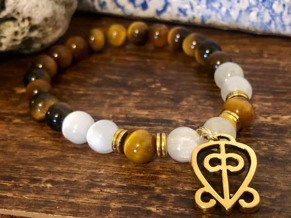 “Love never loses its way home” Tiger eye & Selenite