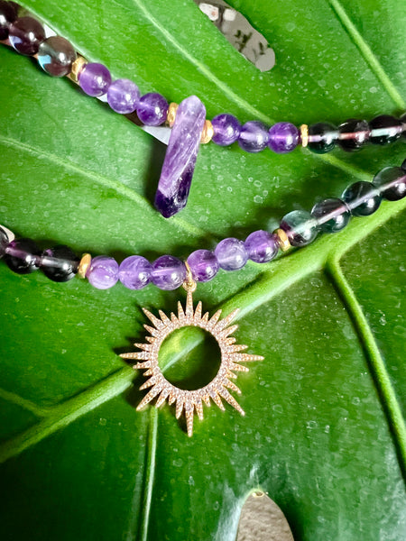 Fluorite and amethyst with sun pendant